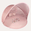 Pink baby tent with floral embroidery on a white background