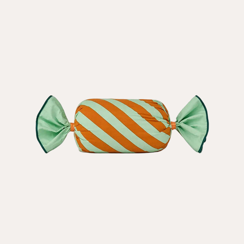 Striped candy with green and orange colors on a white background