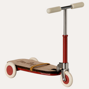 Maileg red mouse kick board with cream wheels and grips, silver handlebars and a strap across the platform.