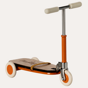 Maileg orange mouse kick board with silver handlebars, cream grips and wheels, and a strap across the platform.