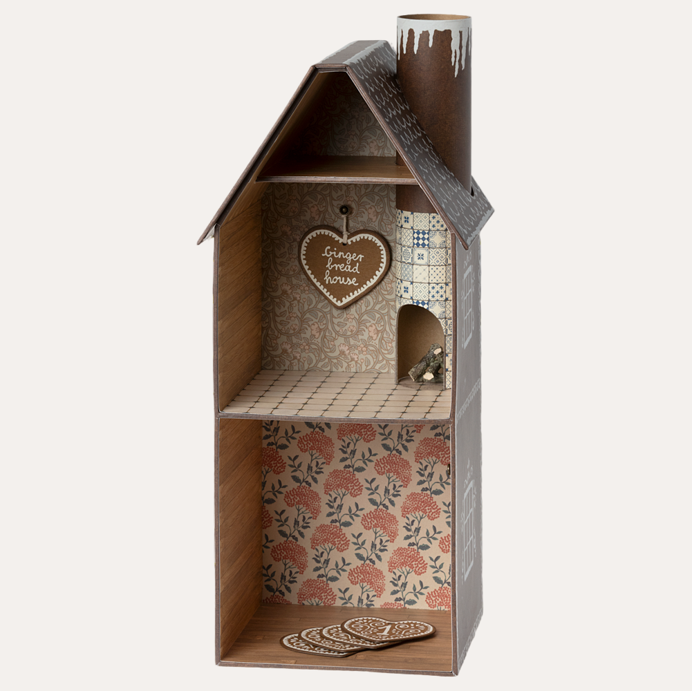 Wooden birdhouse with floral interior and decorative elements on a white background