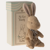 Stuffed bunny toy with a decorative box labeled 'My First Bunny' by Maileg on a white background.