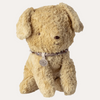 Beige stuffed dog toy with a collar on a white background
