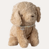 Beige stuffed dog toy with a collar on a white background