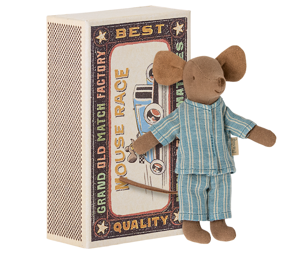 Stuffed mouse toy in pajamas standing next to a matchbox with racing design