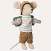 Toy mouse dressed in a striped shirt, shorts, and hat on a white background