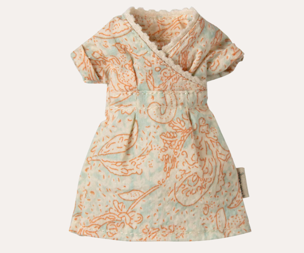 Patterned doll dress on a white background