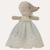Stuffed animal toy with a lace dress on a white background