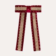 Mimi & Lula Red Circus Glitter Bow with gold glitter stripes, tiny dots and two long straight tails.