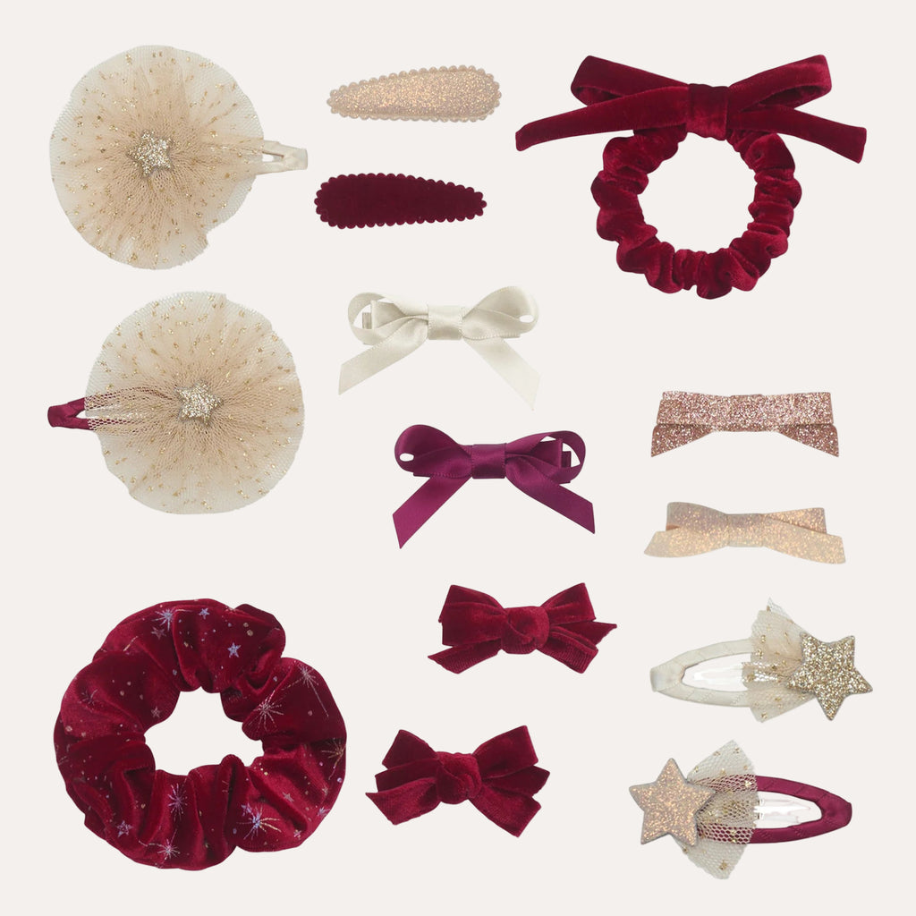Collection of various hair accessories including scrunchies and bows on a white background