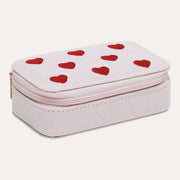 Mimi & Lula Heart Mini Jewellery Box with a pale pink exterior, red hearts across the lid and gold-coloured zip.