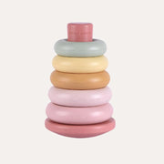 Little Dutch pink stacking rings assembled in a tower with pink, ochre, yellow and pale green rings.
