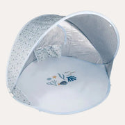 Little Dutch Ocean Dreams blue pop-up tent with an open front and whale illustrations on the floor.