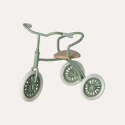 Maileg green Abri A Tricycle for mice with three spoked wheels, curved handlebars and a tan saddle.