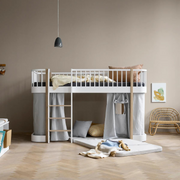 Oliver Furniture Original low loft bed in White/Oak with a left-hand ladder, grey under-bed curtains and floor cushions.