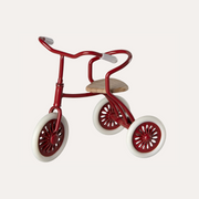 Maileg red Abri A Tricycle for mice with three spoked wheels, curved handlebars and a tan saddle.