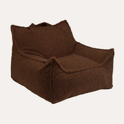 A plush, low-profile lounge bean bag chair in a rich dark brown color, featuring a soft, sherpa-like texture and a matching back cushion, isolated on a white background.