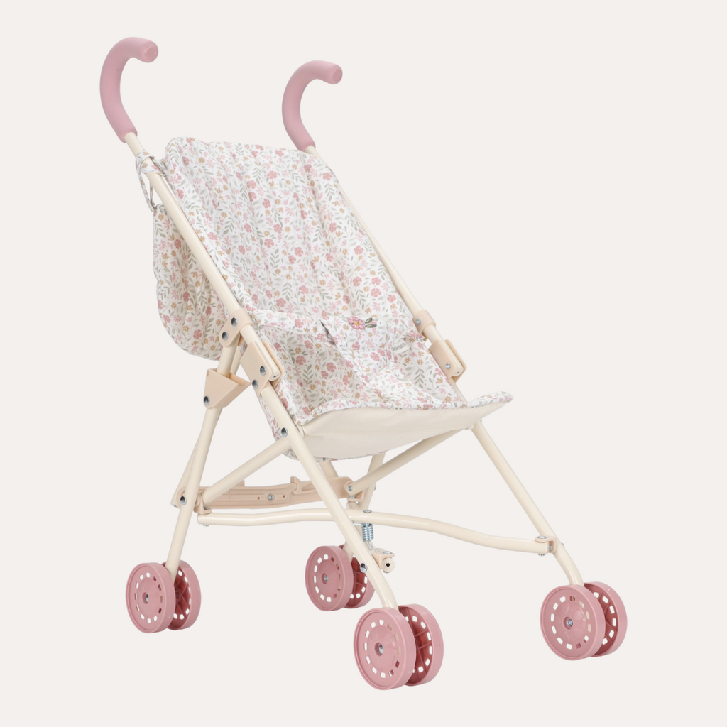 Pink and white baby stroller with floral pattern on a light gray background