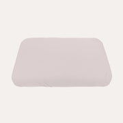 Sebra Birchbark Rose baby jersey bedding sheet fitted over a rounded rectangular mattress, shown on a plain background.