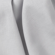 Close-up of Oliver Furniture Mini+ curtain fabric in Grey, showing soft folds and a fine woven texture.