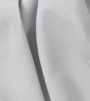 Close-up of Oliver Furniture Classic curtain fabric in grey, gathered into soft folds.