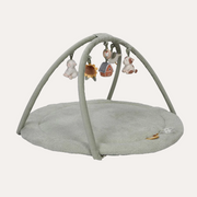 Little Dutch Little Farm Activity Play Mat with a round green base, crossed arches and hanging farm toys.