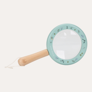 Little Dutch Forest Friends magnifying glass with a pale green illustrated rim and handle, shown at an angle.