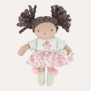 Little Dutch Mini Evi doll with dark bunches, a mint embroidered top, pink floral skirt and pale green socks.