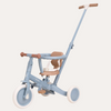 Children's tricycle with light blue frame and brown accents on a white background