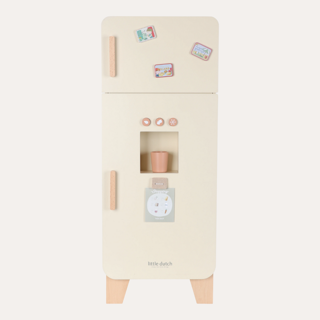 Beige toy refrigerator with wooden handles and small magnets on a white background