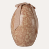 Decorative egg-shaped container with a ribbon on a white background