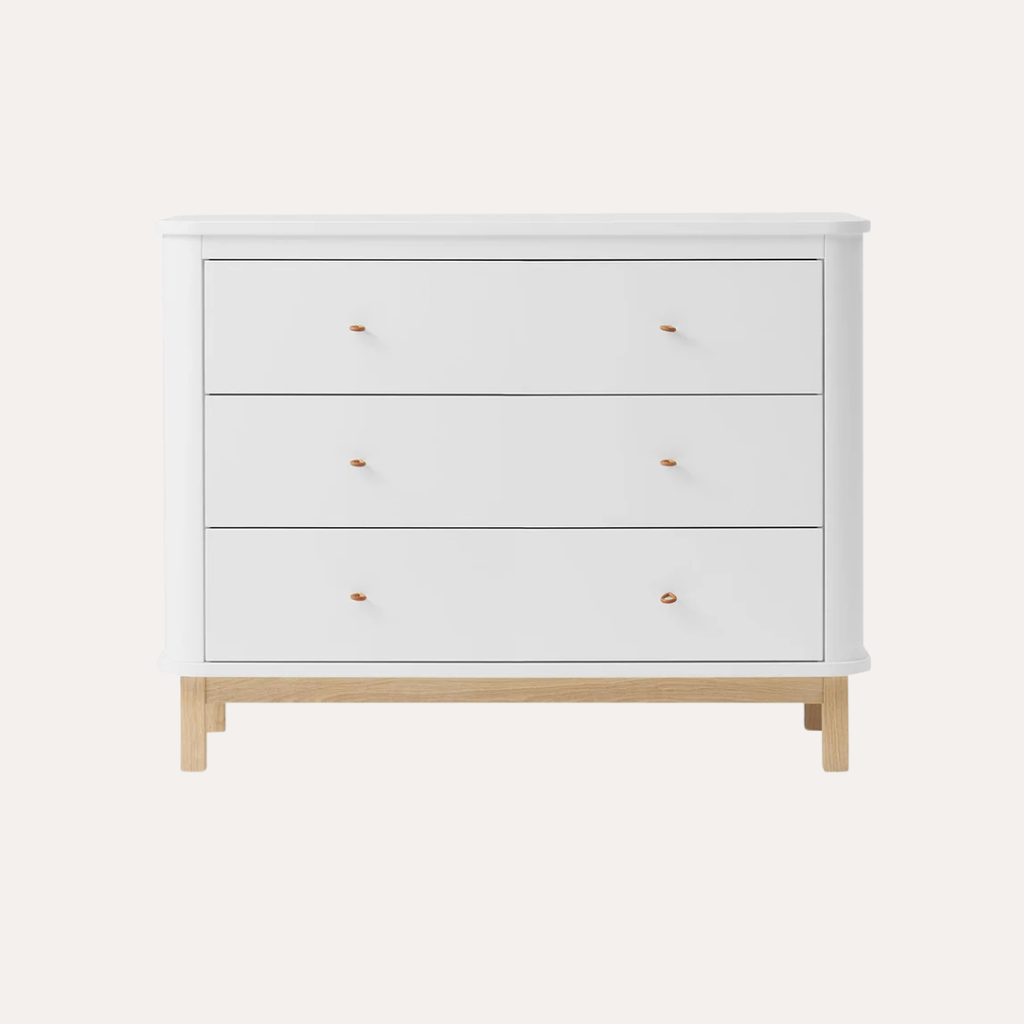 White dresser with wooden legs on a white background