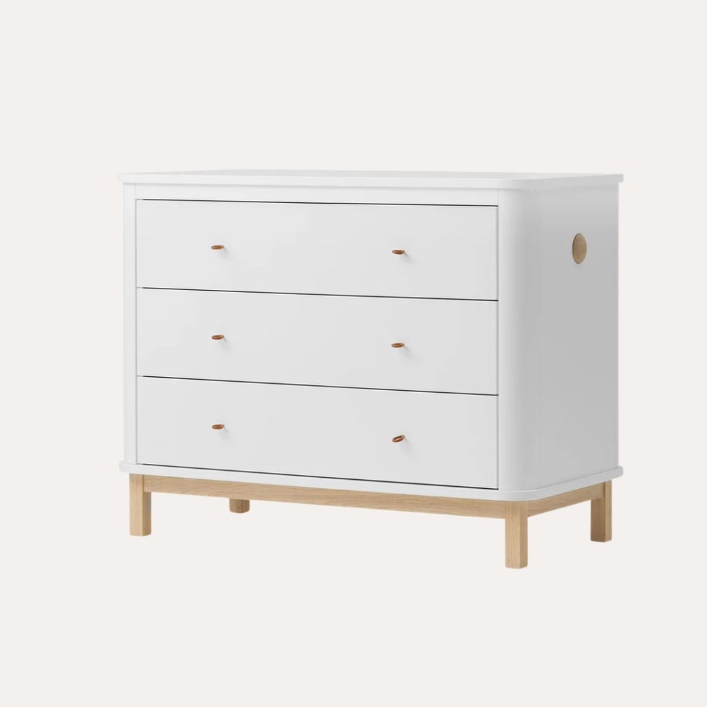 White dresser with wooden legs on a white background