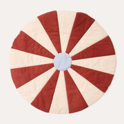 Kid's Concept Red Circus Play Mat with alternating red and cream sections around a pale blue circular centre.