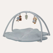 Little Dutch Forest Friends activity play mat with a blue leaf-shaped base, crossed arches and hanging toys.