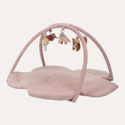 Little Dutch Fairy Garden activity play mat with a pink flower-shaped base, crossed arches and hanging toys.