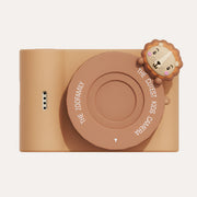 The Zoofamily Urban Zoo Lion camera with a golden body, brown round lens cover and small lion-face detail.