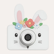 The Zoofamily Rabbit Flower camera with a white rabbit face, tall pink-lined ears and a colourful flower crown.