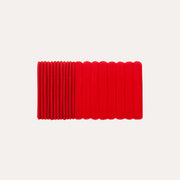 Mimi & Lula red assorted mini pony elastics arranged in a close row, showing different band textures.