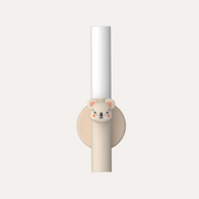 The Zoofamily Koala portable night light upright in its cream circular holder, with a koala detail on the handle.