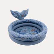 Little Dutch Ocean World blue pool with an upright whale tail and sea life illustrations on the floor and rim.