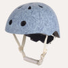 A light blue bicycle helmet with a subtle floral paisley pattern, featuring multiple ventilation holes and cream-colored chin straps, shown against a plain white background.