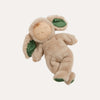 Plush toy resembling a baby in a leaf costume on a white background