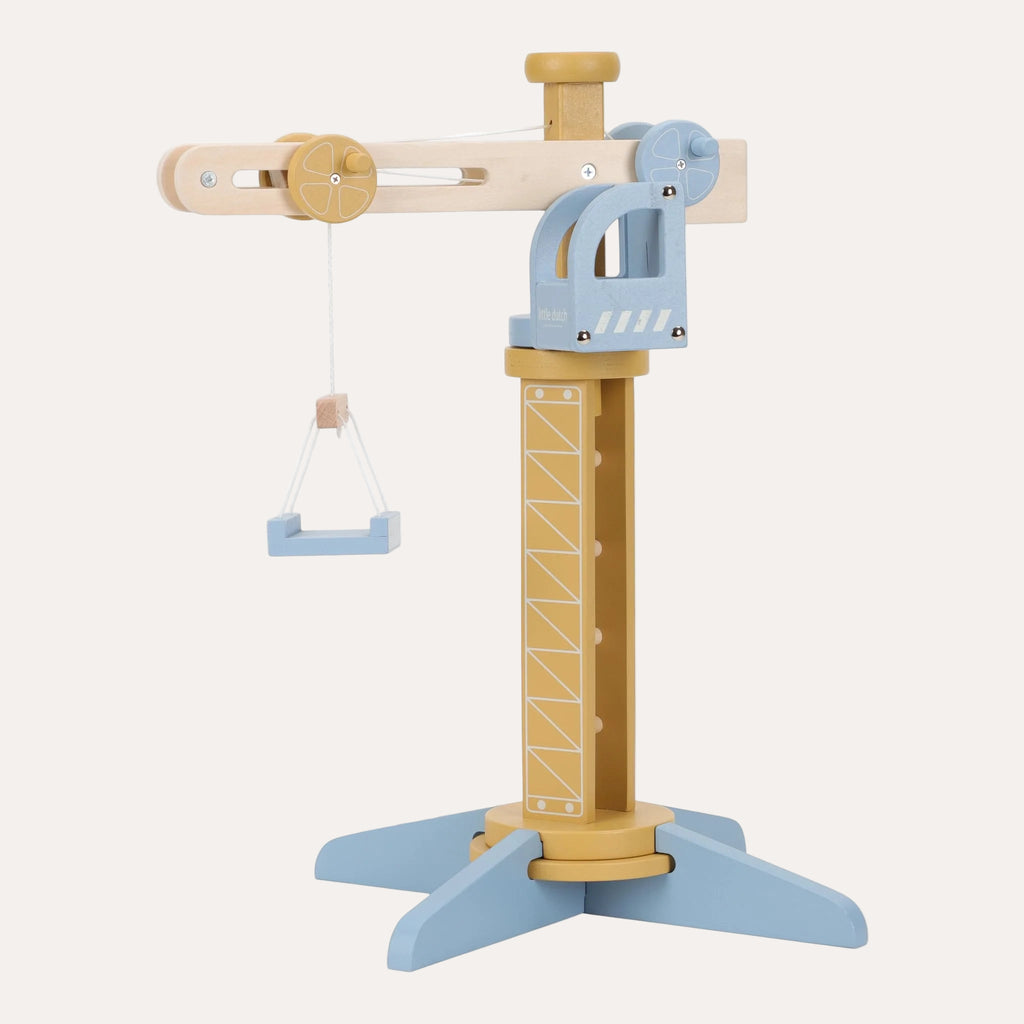 Wooden toy with a crane and swing on a white background