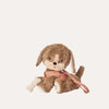 Brown plush dog toy with a pink leash on a white background
