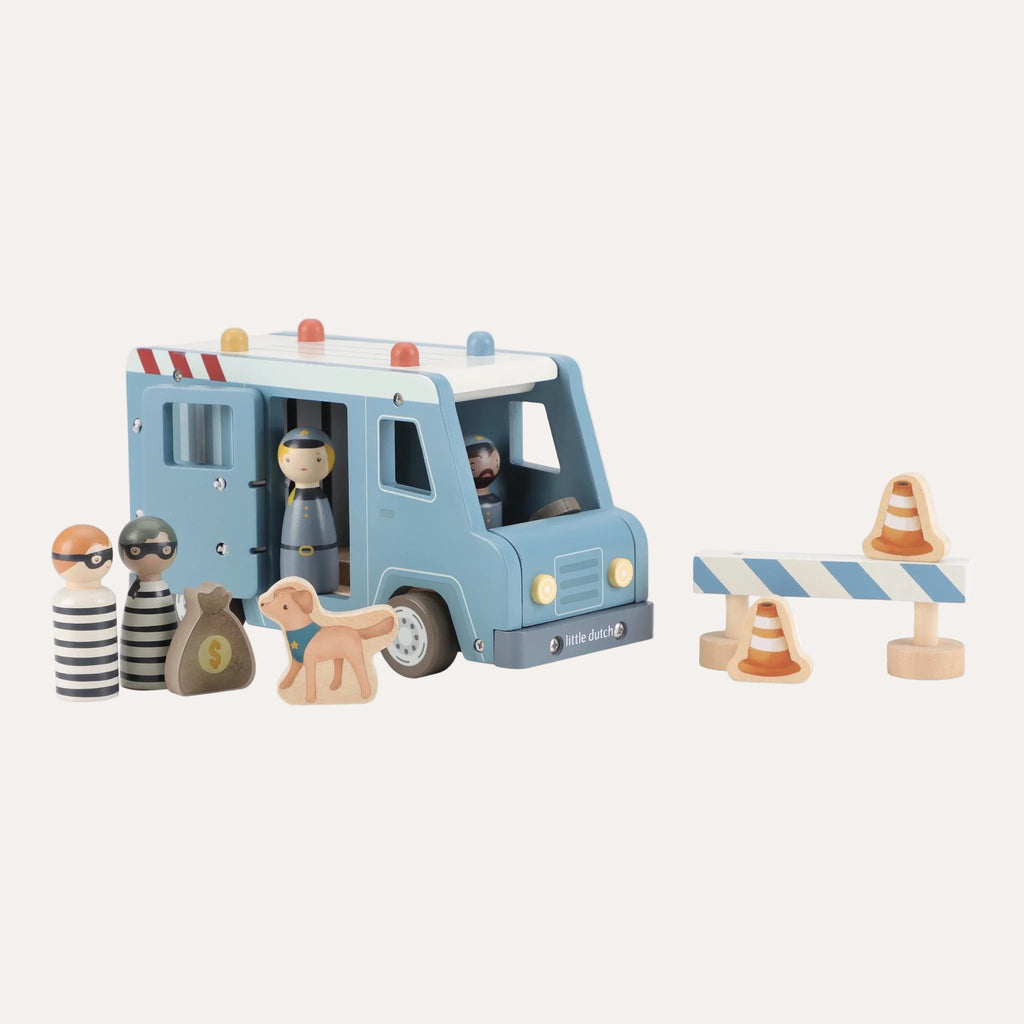 Toy police van with figures and props on a white background