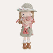 Little Dutch Safari Friends Ranger Rosa doll wearing a green hat and outfit while holding a small pink flamingo.