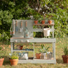 Wooden Mud Kitchen - outdoor childrens play kitchen in mint green blue, with potted plants